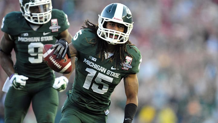 January 1, 2014; Pasadena, CA, USA; Michigan State Spartans cornerback Trae Waynes (15) celebrates after he intercepts a pass against the Stanford Cardinal during the second half at Rose Bowl. Mandatory Credit: Gary A. Vasquez-Imagn Images
