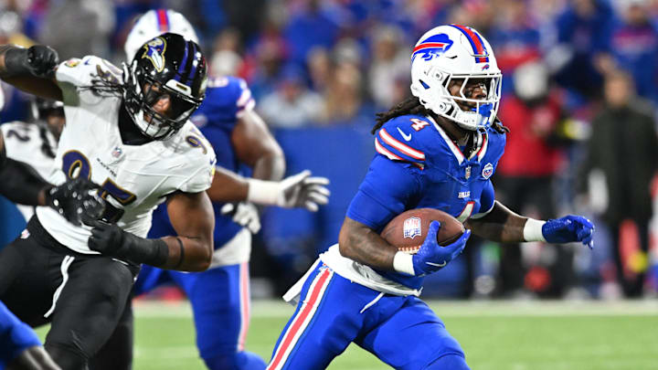 Sep 7, 2025; Orchard Park, New York, USA; Buffalo Bills running back James Cook (4) carries the ball against the Baltimore Ravens in the third quarter at Highmark Stadium. Mandatory Credit: Mark Konezny-Imagn Images