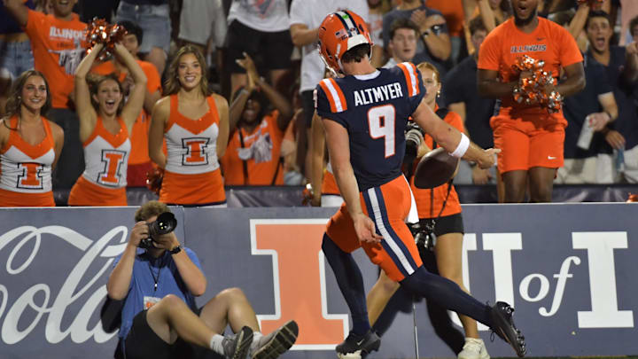 Sep 13, 2025; Champaign, Illinois, USA;  Illinois Fighting Illini quarterback Luke Altmyer (9) runs into the end zone  during the second half against the Western Michigan Broncos at Memorial Stadium. Mandatory Credit: Ron Johnson-Imagn Images