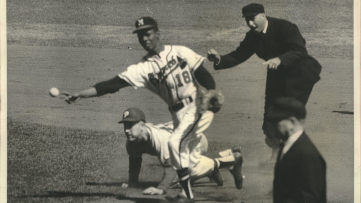 Braves second baseman Felix Mantilla (18) relays the ball to first after tagging out George Anderson of the Phillies in 1959. Braves second baseman Felix Mantilla (18) relays the ball to first after tagging out George Anderson of the Phillies in 1959.