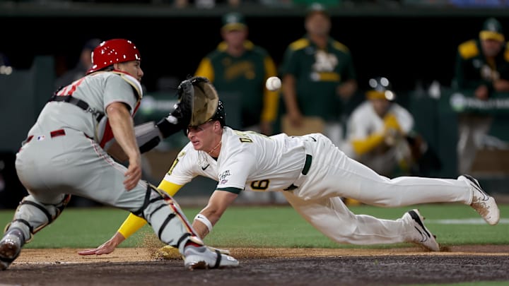 May 24, 2025; West Sacramento, California, USA; Athletics pitch runner Logan Davidson (6) is thrown out at home after Brent Rooker (not pictured) hits a fly ball against the Philadelphia Phillies during the tenth inning at Sutter Health Park. Mandatory Credit: Dennis Lee-Imagn Images