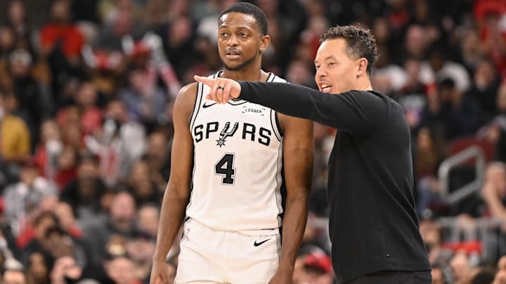 Nov 10, 2025; Chicago, Illinois, USA;  San Antonio Spurs head coach Mitch Johnson talks with guard De'Aaron Fox (4) during the second half against the Chicago Bulls at the United Center. Mandatory Credit: Matt Marton-Imagn Images