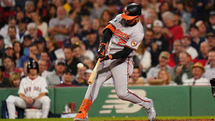 Sep 11, 2024; Boston, Massachusetts, USA; Baltimore Orioles designated hitter Anthony Santander (25) hits a home run against the Boston Red Sox in the eighth inning at Fenway Park. Sep 11, 2024; Boston, Massachusetts, USA; Baltimore Orioles designated hitter Anthony Santander (25) hits a home run against the Boston Red Sox in the eighth inning at Fenway Park.