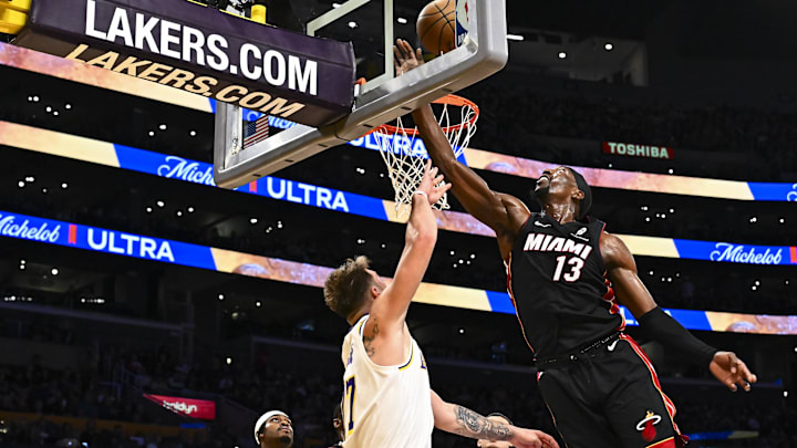 Nov 2, 2025; Los Angeles, California, USA; Miami Heat center/forward Bam Adebayo (13) shoots against Los Angeles Lakers guard Luka Doncic (77) during the second half at Crypto.com Arena. Mandatory Credit: Jonathan Hui-Imagn Images