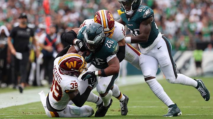 Sep 13, 2026; Philadelphia, Pennsylvania, USA; Philadelphia Eagles running back Saquon Barkley (26) runs the ball against Washington Commanders safety Jeremy Reaves (39) during the first half at Lincoln Financial Field. Mandatory Credit: Bill Streicher-Imagn Images Sep 13, 2026; Philadelphia, Pennsylvania, USA; Philadelphia Eagles running back Saquon Barkley (26) runs the ball against Washington Commanders safety Jeremy Reaves (39) during the first half at Lincoln Financial Field. Mandatory Credit: Bill Streicher-Imagn Images