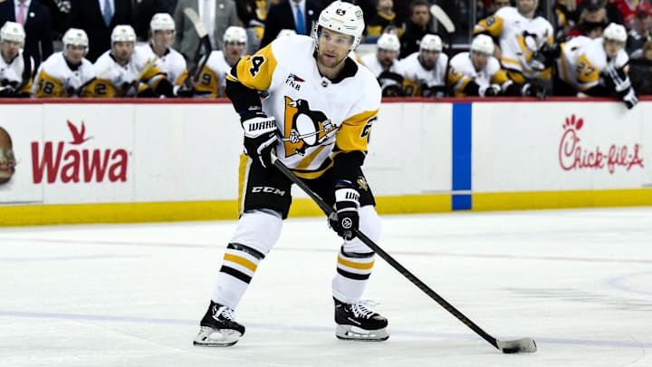 Apr 11, 2025; Newark, New Jersey, USA; Pittsburgh Penguins defenseman Matt Grzelcyk (24) controls the puck during the third period against the New Jersey Devils at Prudential Center. Mandatory Credit: John Jones-Imagn Images