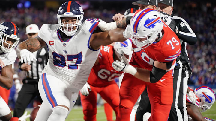New York Giants DT Dexter Lawrence II and Buffalo Bills offensive tackle Spencer Brown shove one another. New York Giants DT Dexter Lawrence II and Buffalo Bills offensive tackle Spencer Brown shove one another.