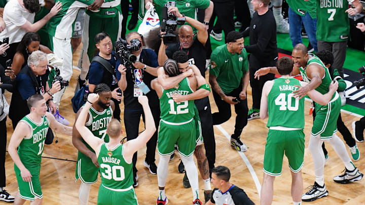 Jun 17, 2024; Boston, Massachusetts, USA; Boston Celtics forward Jayson Tatum (0) celebrates with forward Oshae Brissett (12) after defeating the Dallas Mavericks in game five to win the 2024 NBA Finals at TD Garden. Mandatory Credit: David Butler II-Imagn Images Jun 17, 2024; Boston, Massachusetts, USA; Boston Celtics forward Jayson Tatum (0) celebrates with forward Oshae Brissett (12) after defeating the Dallas Mavericks in game five to win the 2024 NBA Finals at TD Garden. Mandatory Credit: David Butler II-Imagn Images
