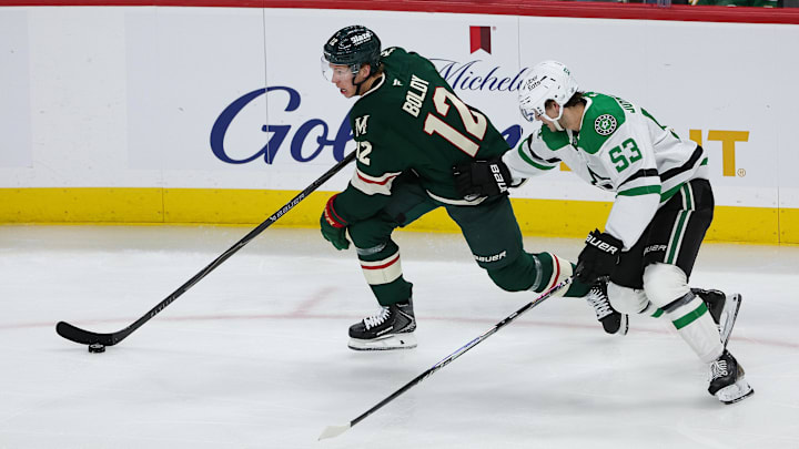 Apr 22, 2026; Saint Paul, Minnesota, USA; Minnesota Wild left wing Matt Boldy (12) skates with the puck as /h53/ defends during the second period in game three of the first round of the 2026 Stanley Cup Playoffs at Grand Casino Arena. Mandatory Credit: Matt Krohn-Imagn Images