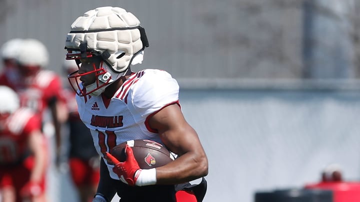 Louisville’s Maurice Turner ran the ball during spring practice Friday afternoon Louisville’s Maurice Turner ran the ball during spring practice Friday afternoon