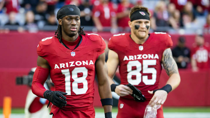 Jan 5, 2025; Glendale, Arizona, USA; Arizona Cardinals wide receiver Marvin Harrison Jr. (18) and tight end Trey McBride (85) against the San Francisco 49ers at State Farm Stadium. Mandatory Credit: Mark J. Rebilas-Imagn Images