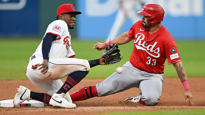 Jun 9, 2025; Cleveland, Ohio, USA; Cincinnati Reds first baseman Christian Encarnacion-Strand (33) steals second as Cleveland Guardians second baseman Angel Martinez (1) waits for the throw during the seventh inning at Progressive Field. Mandatory Credit: Ken Blaze-Imagn Images Jun 9, 2025; Cleveland, Ohio, USA; Cincinnati Reds first baseman Christian Encarnacion-Strand (33) steals second as Cleveland Guardians second baseman Angel Martinez (1) waits for the throw during the seventh inning at Progressive Field. Mandatory Credit: Ken Blaze-Imagn Images