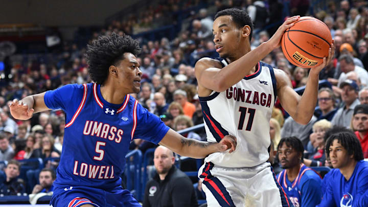 Nov 15, 2024; Spokane, Washington, USA; Gonzaga Bulldogs guard Nolan Hickman (11) controls the ball against UMass Lowell River Hawks guard Martin Somerville (5) in the first half at McCarthey Athletic Center. Mandatory Credit: James Snook-Imagn Images