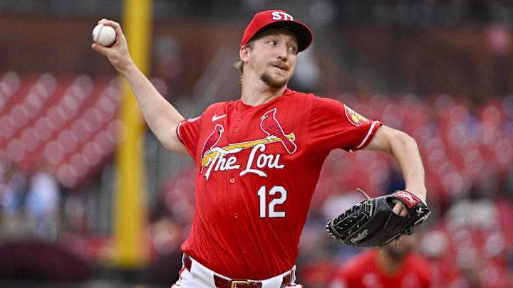 Aug 7, 2024; St. Louis, Missouri, USA;  St. Louis Cardinals starting pitcher Erick Fedde (12) pitches against the Tampa Bay Rays during the first inning at Busch Stadium. Mandatory Credit: Jeff Curry-Imagn Images