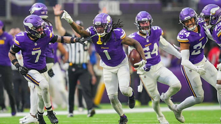 Dec 1, 2024; Minneapolis, Minnesota, USA; Minnesota Vikings cornerback Shaquill Griffin (1) celebrates his interception against the Arizona Cardinals in the fourth quarter at U.S. Bank Stadium. Mandatory Credit: Brad Rempel-Imagn Images