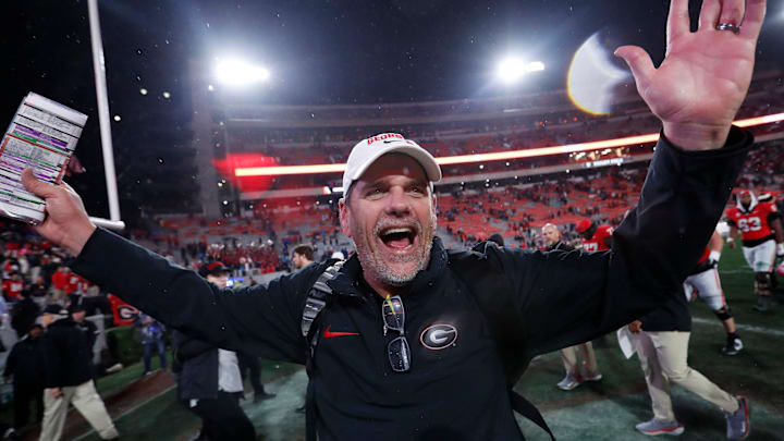 Georgia Offensive Coordinator Mike Bobo celebrates after wining a NCAA college football game against Ole Miss in Athens, Ga., on Saturday, Nov. 11, 2023. Georgia won 52-17.