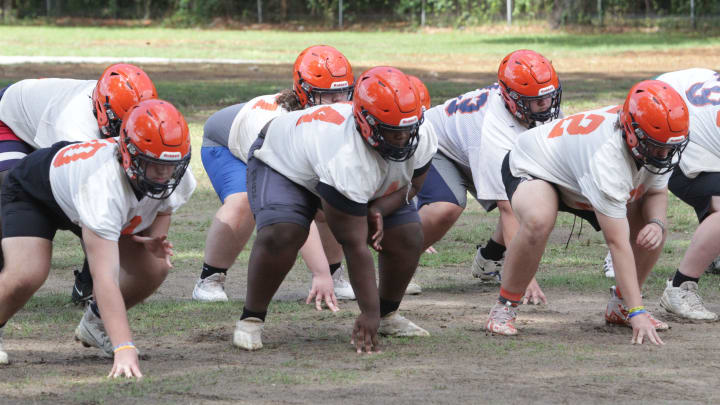 Members of the offensive line go through a drill during the Escambia football team's spring practice on Tuesday, April 30, 2024.