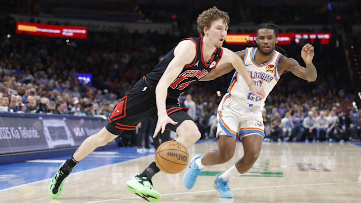Mar 31, 2025; Oklahoma City, Oklahoma, USA; Chicago Bulls forward Matas Buzelis (14) drives to the basket around Oklahoma City Thunder guard Cason Wallace (22)