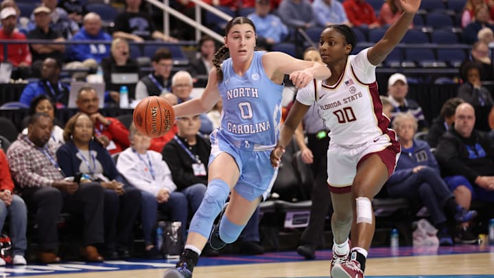 Mar 7, 2025; Greensboro, NC, USA;  North Carolina Tar Heels guard Lanie Grant (0) drives to the basket during the second quarter at First Horizon Coliseum. Mandatory Credit: Cory Knowlton-Imagn Images
