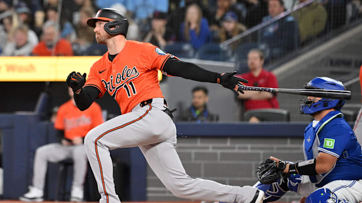Mar 29, 2025; Toronto, Ontario, CAN; Baltimore Orioles second baseman Jordan Westburg (11) hits a solo home run against the Toronto Blue Jays in the first inning at Rogers Centre.