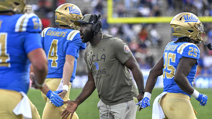 Nov 30, 2024; Pasadena, California, USA; UCLA Bruins head coach DeShaun Foster greets his players after a Bruins touchdown against the Fresno State Bulldogs in the third quarter at Rose Bowl. Mandatory Credit: Robert Hanashiro-Imagn Images