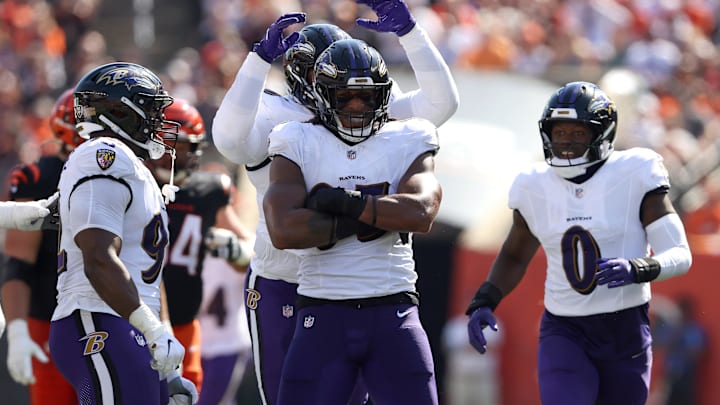Oct 6, 2024; Cincinnati, Ohio, USA; Baltimore Ravens linebacker Tavius Robinson (95) celebrates a sack during the first half against the Cincinnati Bengals at Paycor Stadium. Mandatory Credit: Joseph Maiorana-Imagn Images Oct 6, 2024; Cincinnati, Ohio, USA; Baltimore Ravens linebacker Tavius Robinson (95) celebrates a sack during the first half against the Cincinnati Bengals at Paycor Stadium. Mandatory Credit: Joseph Maiorana-Imagn Images