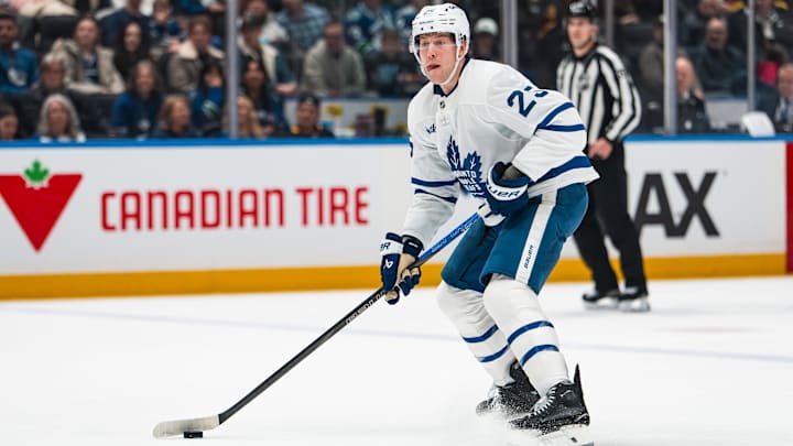 Jan 31, 2026; Vancouver, British Columbia, CAN; Toronto Maple Leafs defenseman Brandon Carlo (25) handles the puck against the Vancouver Canucks in the first period at Rogers Arena. Mandatory Credit: Bob Frid-Imagn Images