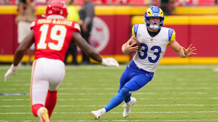Aug 15, 2026; Kansas City, Missouri, USA; Los Angeles Rams running back Dean Connors (33) runs with the ball against Kansas City Chiefs cornerback D'Arco Perkins-McAllister (19) during the second half at at Arrowhead Stadium. Mandatory Credit: Jay Biggerstaff-Imagn Images Aug 15, 2026; Kansas City, Missouri, USA; Los Angeles Rams running back Dean Connors (33) runs with the ball against Kansas City Chiefs cornerback D'Arco Perkins-McAllister (19) during the second half at at Arrowhead Stadium. Mandatory Credit: Jay Biggerstaff-Imagn Images