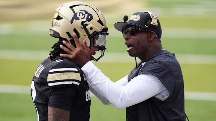 Aug 29, 2025; Boulder, Colorado, USA; Colorado Buffaloes head coach Deion Sanders congratulates Colorado Buffaloes quarterback Kaidon Salter (3) following a touchdown pass in the first quarter against the Georgia Tech Yellow Jackets at Folsom Field. Mandatory Credit: Ron Chenoy-Imagn Images