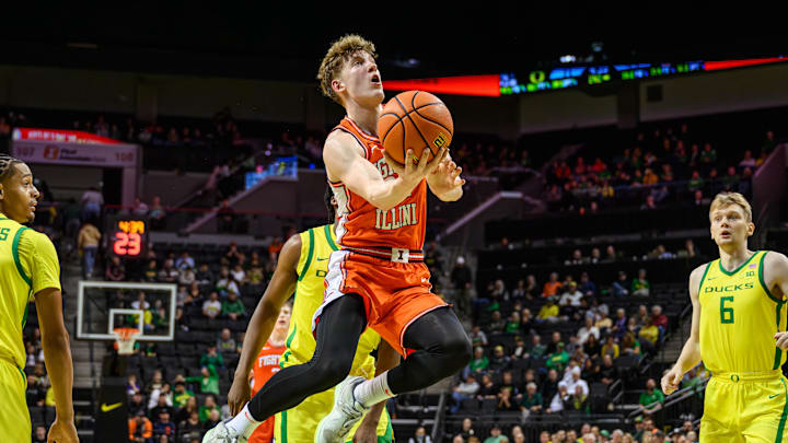 Jan 2, 2025; Eugene, Oregon, USA; Illinois Fighting Illini guard Kasparas Jakucionis (32) drives to the basket during the second half against the Oregon Ducks at Matthew Knight Arena. Mandatory Credit: Craig Strobeck-Imagn Images