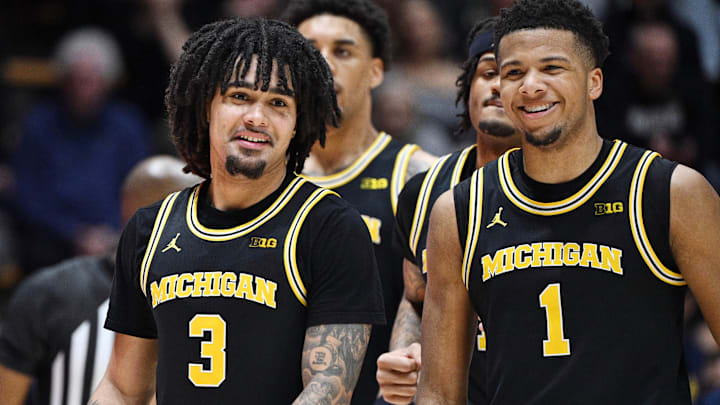 Feb 17, 2026; West Lafayette, Indiana, USA; Michigan Wolverines guard Elliot Cadeau (3) shares a moment with Michigan Wolverines guard Trey McKenney (1) during the second half against the Purdue Boilermakers at Mackey Arena. Mandatory Credit: Marc Lebryk-Imagn Images Feb 17, 2026; West Lafayette, Indiana, USA; Michigan Wolverines guard Elliot Cadeau (3) shares a moment with Michigan Wolverines guard Trey McKenney (1) during the second half against the Purdue Boilermakers at Mackey Arena. Mandatory Credit: Marc Lebryk-Imagn Images