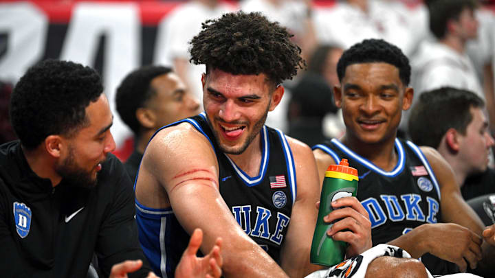 Cameron Boozer shows off his scars to a teammate during Duke’s win over NC State.