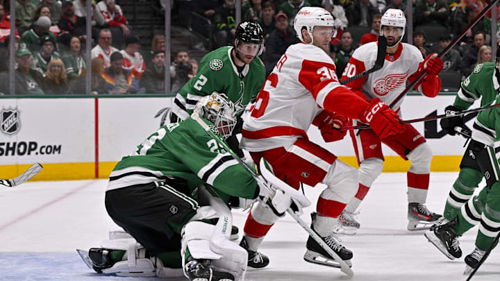 Jan 19, 2025; Dallas, Texas, USA; Detroit Red Wings right wing Christian Fischer (36) screens Dallas Stars goaltender Jake Oettinger (29) during the third period at the American Airlines Center. Mandatory Credit: Jerome Miron-Imagn Images