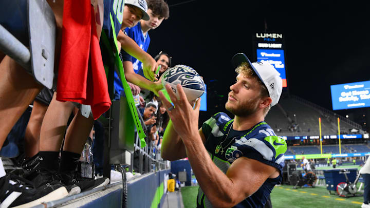 Aug 7, 2025; Seattle, Washington, USA; Seattle Seahawks wide receiver Cooper Kupp (10) interacts with fans after the game against the Las Vegas Raiders at Lumen Field. Mandatory Credit: Steven Bisig-Imagn Images