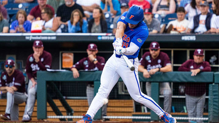 Jun 19, 2024; Omaha, NE, USA; Florida Gators first baseman Jac Caglianone (14) hits a single against the Texas A&M Aggies during the third inning at Charles Schwab Field Omaha. Mandatory Credit: Dylan Widger-Imagn Images Jun 19, 2024; Omaha, NE, USA; Florida Gators first baseman Jac Caglianone (14) hits a single against the Texas A&M Aggies during the third inning at Charles Schwab Field Omaha. Mandatory Credit: Dylan Widger-Imagn Images