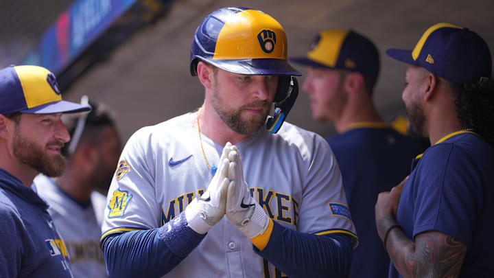 Jun 22, 2025: Milwaukee Brewers first base Rhys Hoskins (12) celebrates his run against the Minnesota Twins in the second inning at Target Field. 
