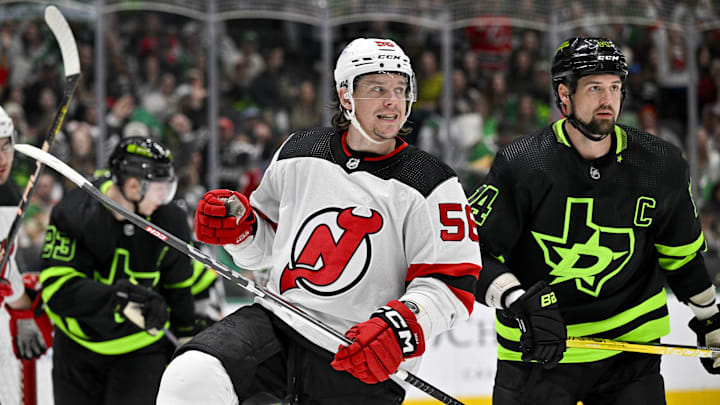 Mar 14, 2024; Dallas, Texas, USA; New Jersey Devils left wing Erik Haula (56) celebrates after he scores a goal as Dallas Stars left wing Jamie Benn (14) looks on during the first period at the American Airlines Center. Mandatory Credit: Jerome Miron-Imagn Images