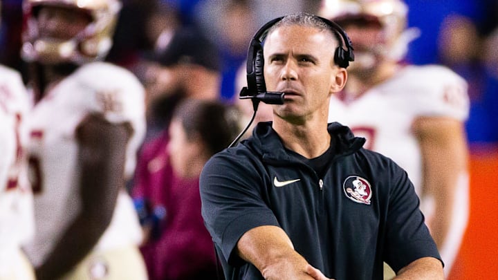Florida State Seminoles head coach Mike Norvell looks to the replay screen at Steve Spurrier Field at Ben Hill Griffin Stadium in Gainesville, FL on Saturday, November 25, 2023 during the first half. [Doug Engle/Gainesville Sun]