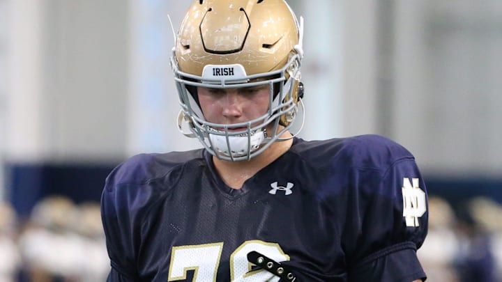 Junior left tackle Joe Alt (76) goes through drills for the Notre Dame football team