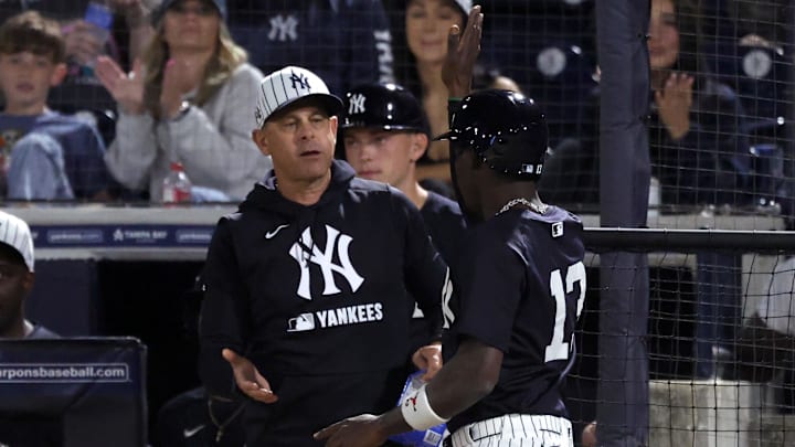 Mar 3, 2025; Tampa, Florida, USA; New York Yankees third base Jazz Chisholm Jr. (13) is congratulated by manager Aaron Boone (17) after he scored a run during the fifth inning against the Pittsburgh Pirates  at George M. Steinbrenner Field. Mandatory Credit: Kim Klement Neitzel-Imagn Images
