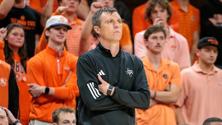 Texas A&M Aggies coach Bucky McMillan watches game play during the second half against the Oklahoma State Cowboys at Gallagher-Iba Arena.