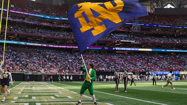 Oct 19, 2024; Atlanta, Georgia, USA; Notre Dame Fighting Irish mascot the Leprechaun waves a flag after a touchdown against the Georgia Tech Yellow Jackets in the third quarter at Mercedes-Benz Stadium. Mandatory Credit: Brett Davis-Imagn Images

