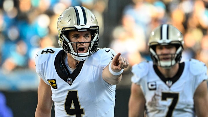 Nov 3, 2024; Charlotte, North Carolina, USA; New Orleans Saints quarterback Derek Carr (4) at the line of scrimmage in the fourth qarter at Bank of America Stadium. Mandatory Credit: Bob Donnan-Imagn Images