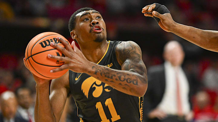 Feb 14, 2024; College Park, Maryland, USA; Iowa Hawkeyes guard Tony Perkins (11) reacts as Maryland Terrapins forward Jordan Geronimo (22) defends during the first half at Xfinity Center. Mandatory Credit: Tommy Gilligan-Imagn Images Feb 14, 2024; College Park, Maryland, USA; Iowa Hawkeyes guard Tony Perkins (11) reacts as Maryland Terrapins forward Jordan Geronimo (22) defends during the first half at Xfinity Center. Mandatory Credit: Tommy Gilligan-Imagn Images
