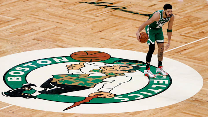 Apr 7, 2021; Boston, Massachusetts, USA: Boston Celtics forward Jayson Tatum (0) brings the ball up past half court over the Celtics logo during the third quarter against the New York Knicks at TD Garden. Mandatory Credit: Winslow Townson-Imagn Images
