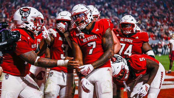 Nov 21, 2025; Raleigh, North Carolina, USA;  NC State Wolfpack tight end Justin Joly (7) celebrates his touchdown to win the game during the second half of the game against Florida State Seminoles at Carter-Finley Stadium. Mandatory Credit: Jaylynn Nash-Imagn Images