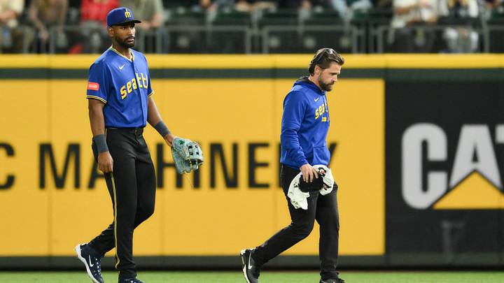 Sep 4, 2026; Seattle, Washington, USA; Seattle Mariners right fielder Lazaro Montes (99) leaves the game with an apparent injury with head athletic trainer Kyle Torgerson during the fifth inning against the Athletics at T-Mobile Park. Mandatory Credit: Steven Bisig-Imagn Images Sep 4, 2026; Seattle, Washington, USA; Seattle Mariners right fielder Lazaro Montes (99) leaves the game with an apparent injury with head athletic trainer Kyle Torgerson during the fifth inning against the Athletics at T-Mobile Park. Mandatory Credit: Steven Bisig-Imagn Images