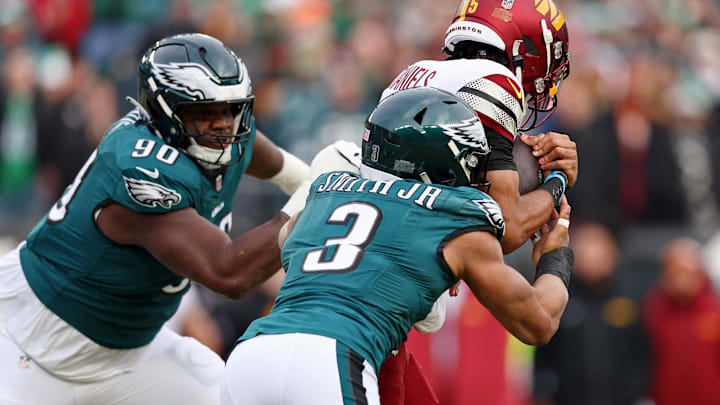 Jan 26, 2025; Philadelphia, PA, USA; Philadelphia Eagles defensive tackle Jordan Davis (90) and linebacker Nolan Smith Jr. (3) tackle Washington Commanders quarterback Jayden Daniels (5) during the first half of the NFC Championship game at Lincoln Financial Field. Mandatory Credit: Bill Streicher-Imagn Images