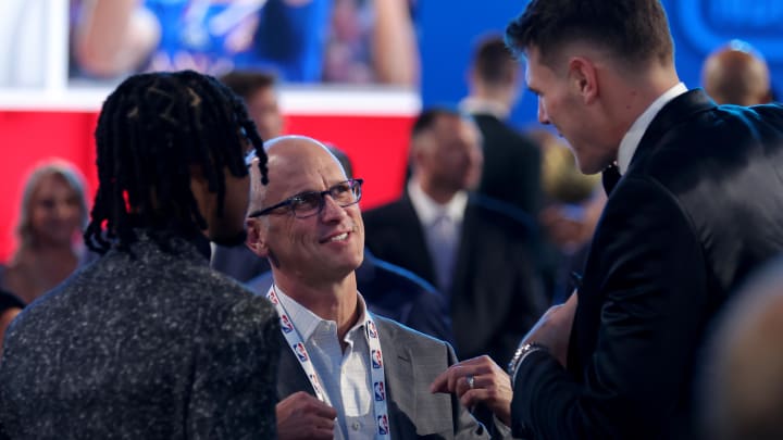 Jun 26, 2024; Brooklyn, NY, USA; Connecticut Huskies head coach Dan Hurley talks to Stephon Castle (left) and Donovan Clingan (right) before the start of the first round of the 2024 NBA Draft at Barclays Center. Mandatory Credit: Brad Penner-USA TODAY Sports