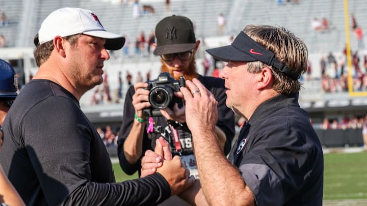 Mississippi State Bulldogs head coach Jeff Lebby and Georgia Bulldogs head coach Kirby Smart meet on the field after the game at Davis Wade Stadium at Scott Field. Mississippi State Bulldogs head coach Jeff Lebby and Georgia Bulldogs head coach Kirby Smart meet on the field after the game at Davis Wade Stadium at Scott Field.